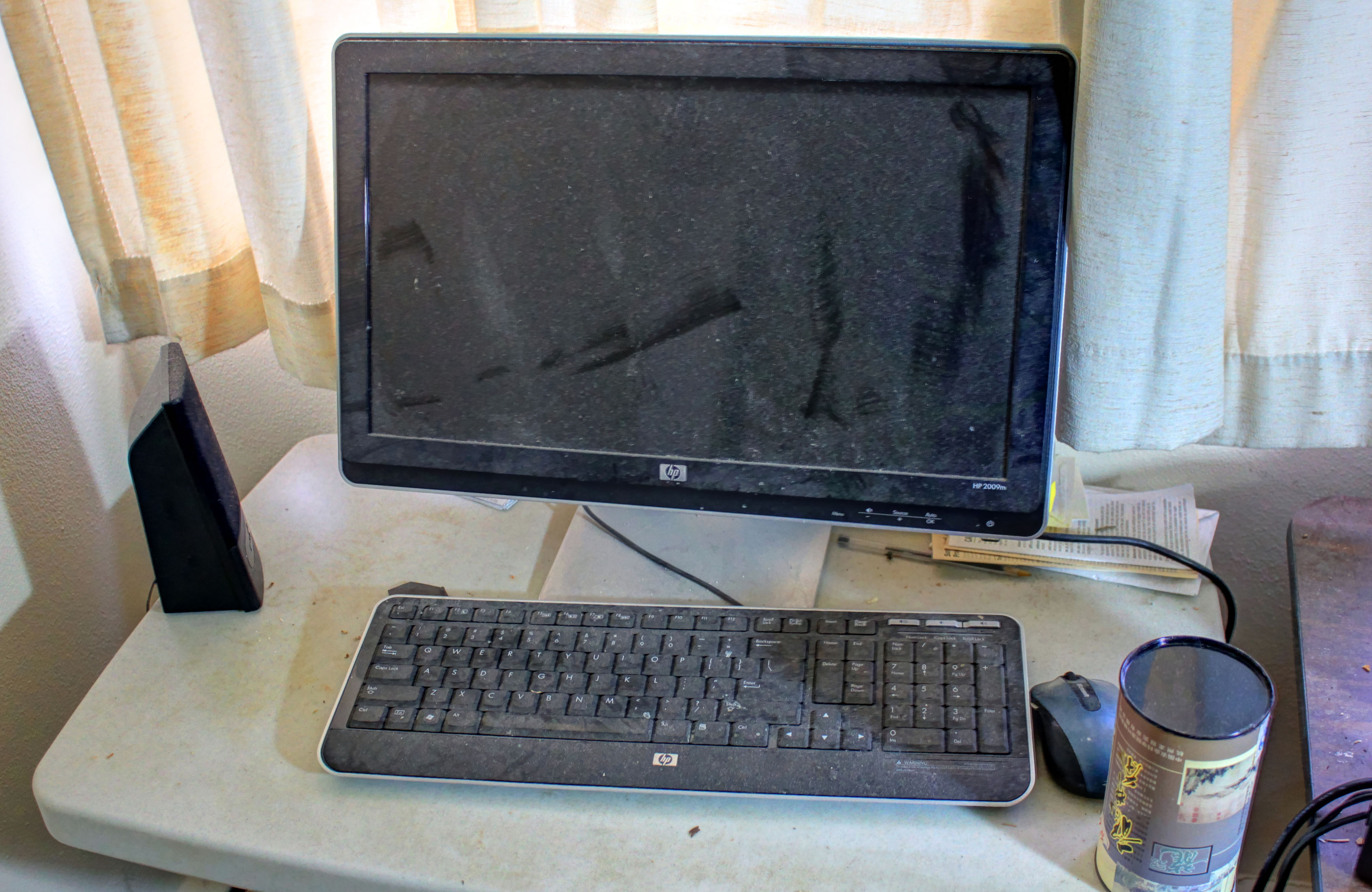 Dusty computer screen and keyboard